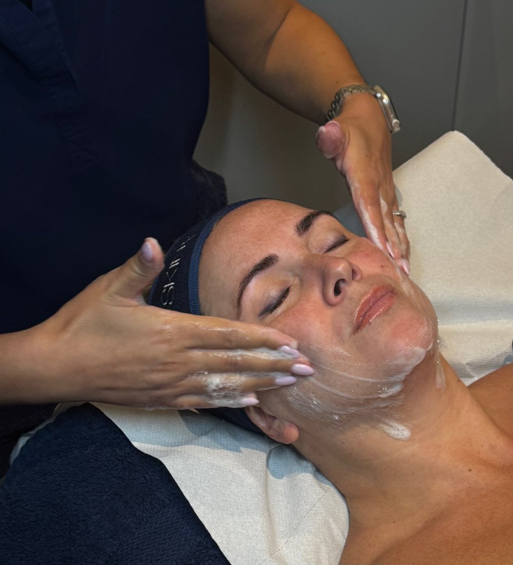 Client enjoying an Alumier MD Bespoke Luxury Medi-Facial at SKIN lounge Aesthetics Richmond, a customised medical-grade treatment designed to deeply cleanse, nourish, and revitalise the skin for a glowing, youthful complexion.