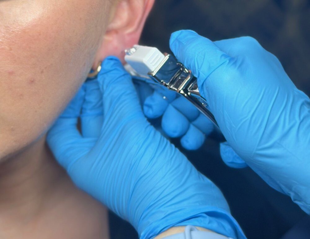 Sterex 9ct Gold Ear Piercing – SKIN lounge Aesthetics Richmond Client receiving a Sterex 9ct gold ear piercing at SKIN lounge Aesthetics Richmond, using a sterile, professional technique for safe results.
