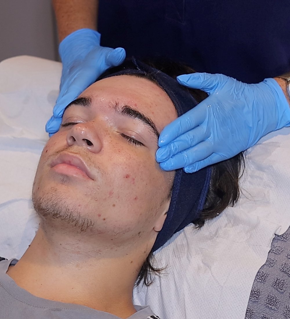 Client enjoying a HydraClean deep-cleansing facial at SKIN lounge Aesthetics Richmond Hill, an expert treatment combining professional techniques and targeted skincare to deeply cleanse, purify, and reduce acne, congestion, and scarring.